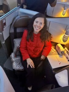 American Airlines new premium seating with wine travel writer Jamie Knee